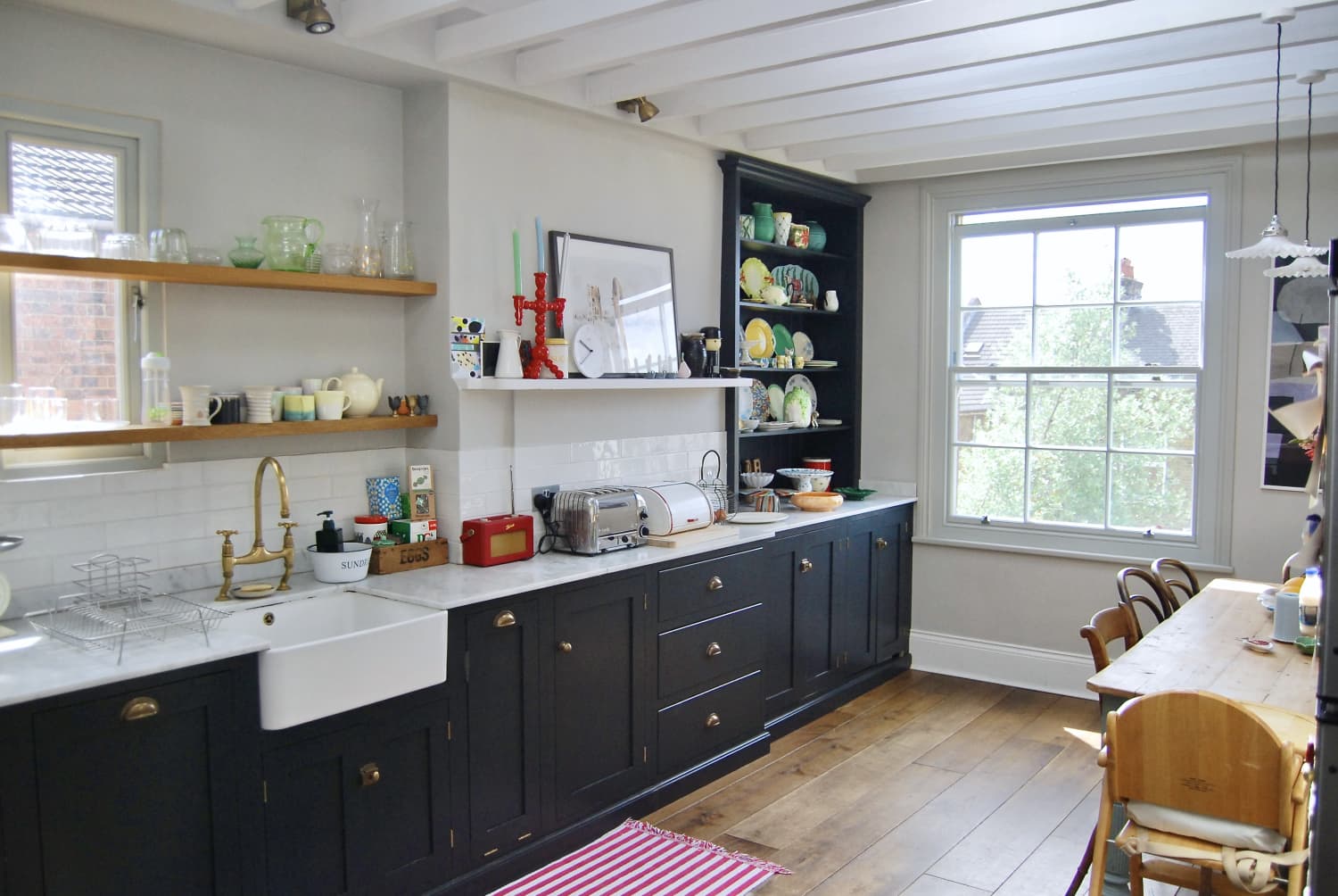 This tiktoker turned a custom bookcase into a kitchen cabinet flipboard